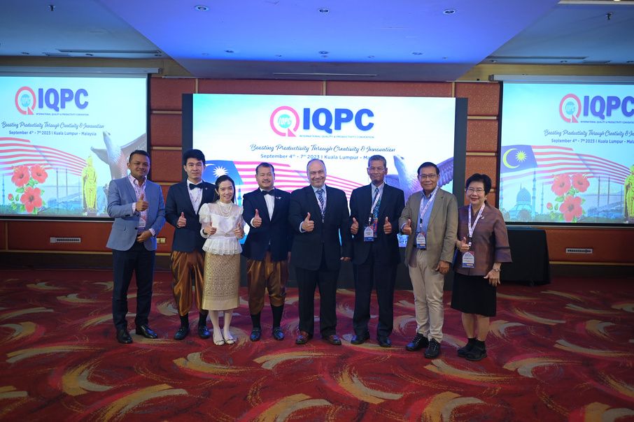 Speakers and delegates on stage in front of the IQPC backdrop.